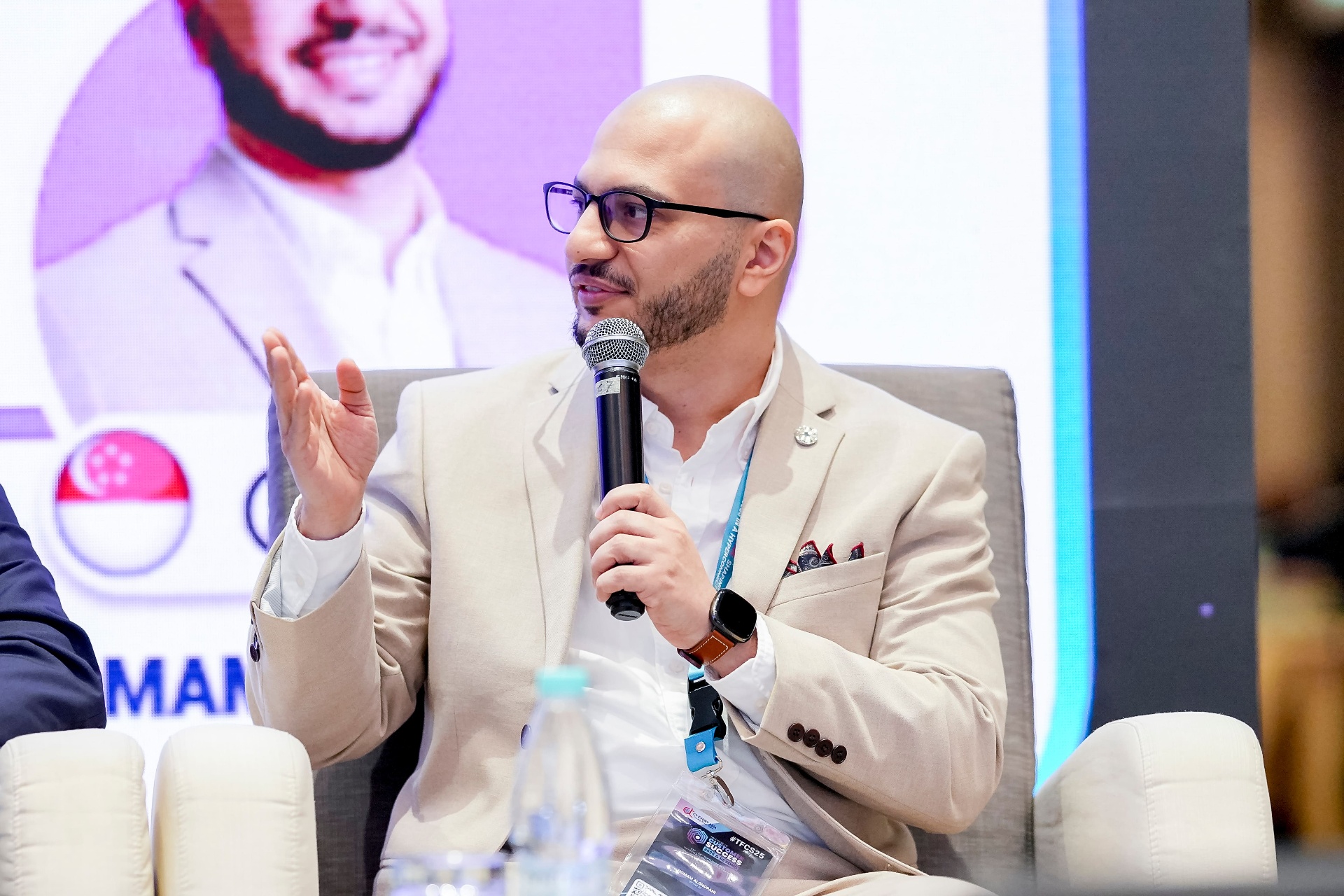 Homam Alghorani speaking on a panel